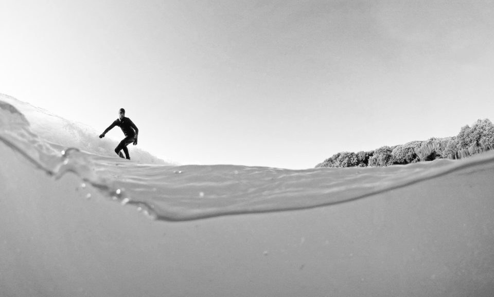 Amazing over under photo of a surfer